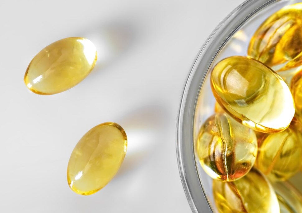fish oil capsules in a glass bowl