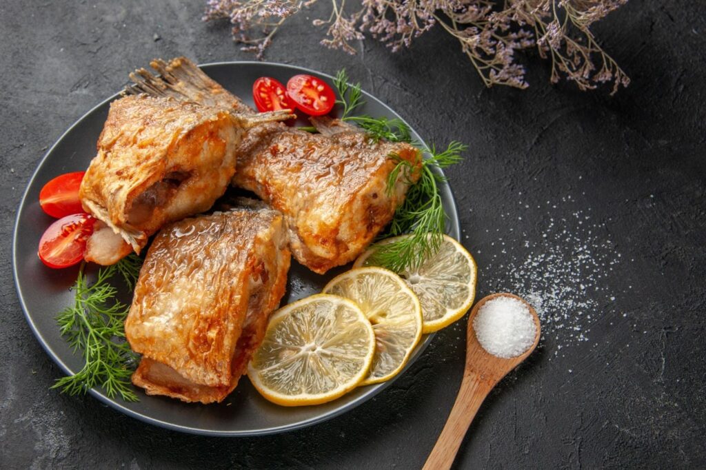 Fry fish with lemon and vegetables